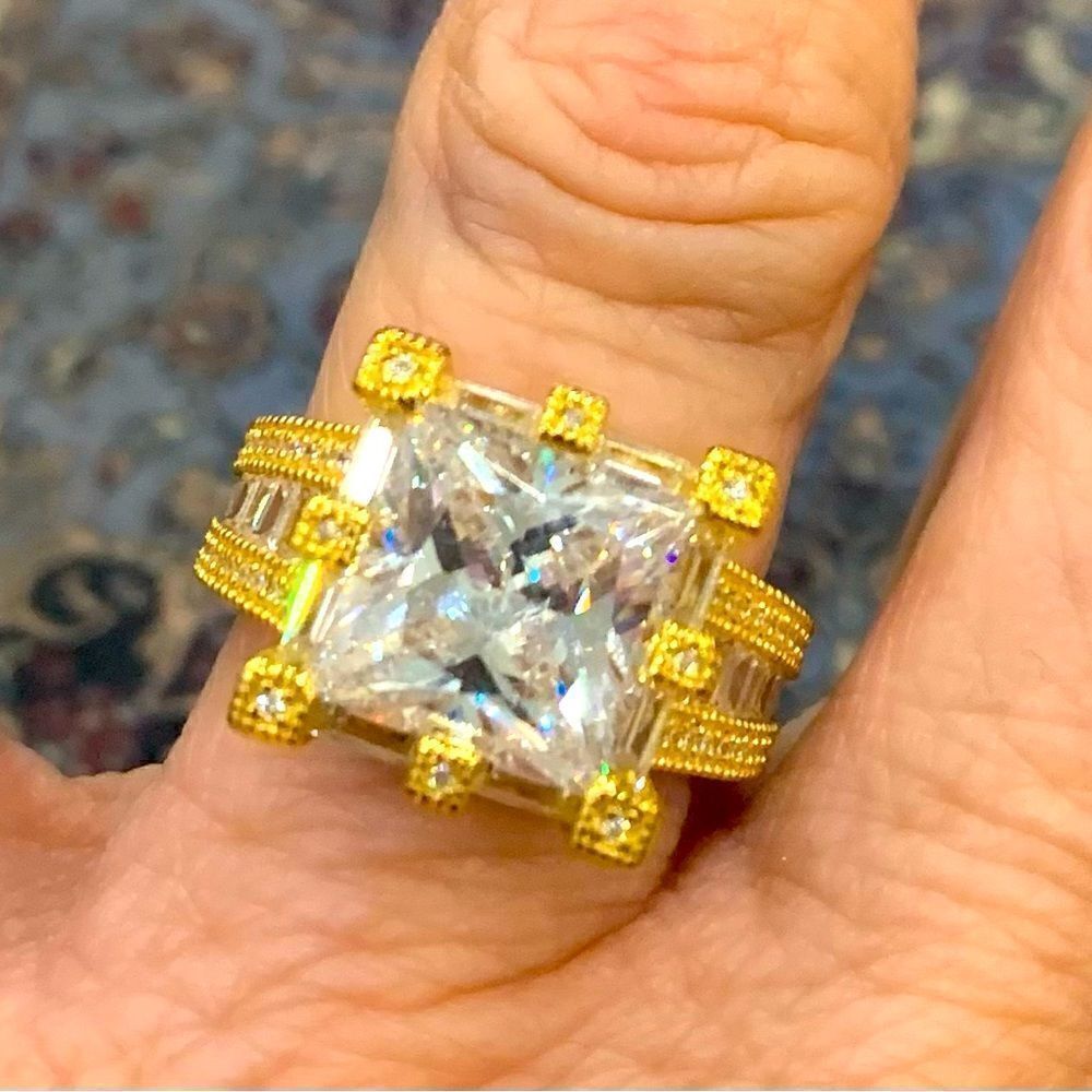 Size 7 gold over silver solitaire . Unique square stone and setting